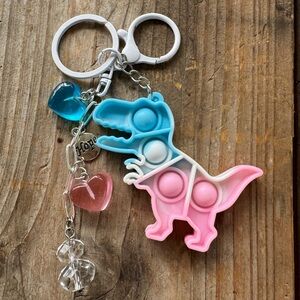 Dinosaur pop it blue and  pink puffy hearts silver charm hope  sh charm key fob